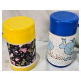 Lot of Vintage Lunch Box Thermo Bottles Featuring Various Designs such as Aladdin and Sesame Street