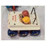 Fisher-Price Vintage Toys including 1973 Bouncing Buggy, Cookie Monster Pull Toy, and Measuring Man