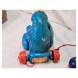 Fisher-Price Vintage Toys including 1973 Bouncing Buggy, Cookie Monster Pull Toy, and Measuring Man