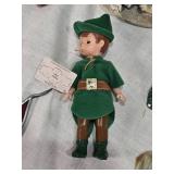 Figurines and Collectibles Including Peter Pan Doll, Cultural Dolls, Woven Bunny, Ceramic Stagecoach Shaker, and Animal Figures