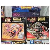 Huge Lot of Star Wars Puzzles including The Empire Strikes Back 1500 Piece Puzzle, Episode I Podrace Challenge Puzzle, and Lenticular Puzzles - Uncounted