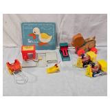 Fisher-Price Toys including Lumber Yard and Toot-Toot Trains, Pull Toy Bear, and Ugly Duckling Puzzle with Glued In Pieces