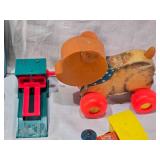 Fisher-Price Toys including Lumber Yard and Toot-Toot Trains, Pull Toy Bear, and Ugly Duckling Puzzle with Glued In Pieces