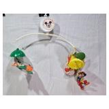 Vintage and Modern Toys Collection including Disney Mobiles, Tomy Toys, and Fisher-Price Carousel