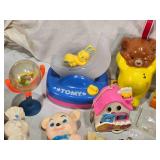 Vintage and Modern Toys Collection including Disney Mobiles, Tomy Toys, and Fisher-Price Carousel