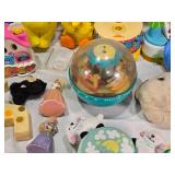Vintage and Modern Toys Collection including Disney Mobiles, Tomy Toys, and Fisher-Price Carousel