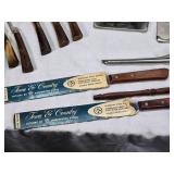 Assorted kitchen utensils and vintage tools including Town & Country cutlery and White Decorative Zigzagger, Acme Nut Chopper, and other items.