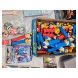 Lot of Vintage Toys and Collectibles including Little Tikes Piggy Bank, Toy Story Kite, and Trading Cards Like PukeMon