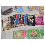 Lot of Vintage Toys and Collectibles including Little Tikes Piggy Bank, Toy Story Kite, and Trading Cards Like PukeMon