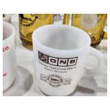 Assorted mugs and glasses including Kimball MN glass mug, Lutsen Glass, Oakley National Bank, Budweiser mugs, and various commemorative mugs