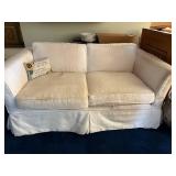 White Two-Seater Sofa with Cushions