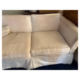 White Two-Seater Sofa with Cushions