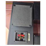 2 Polk Audio RT600i floor standing tower speakers and 1 Polk Audio CS400i center channel speaker.