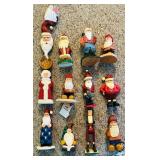 LL - Collection of 12 Hand-Carved Wooden Santa Figurines by Pobbies Crafty Crafts