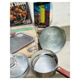 LR - Vintage Camp Cookware Collection with Cast Iron, Percolator, Lantern, and Steamer Kettle