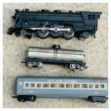 K - Set of 3 Vintage Model Train Cars including Locomotive, Tanker, and New York Central Passenger Car