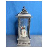 Snow Globe Lantern with a Snowman Scene Inside.
