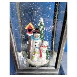 Snow Globe Lantern with a Snowman Scene Inside.