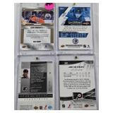 Lot of 8 Hockey Cards All in Magnetic One Touch Cases Featuring Key Players Including Leon Draisaitl, Cale Makar, and Matty Beniers