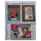 Lot of 7 Baseball Cards in Magnetic and Screw Down One Touch Cases Featuring Alfonso Soriano, Mike Trout, and Roger Clemens with Autographs and Relics.