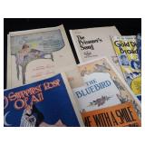 2 VINTAGE BRASS FRENCH HORNS PLUS SHEET MUSIC.