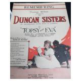 2 VINTAGE BRASS FRENCH HORNS PLUS SHEET MUSIC.