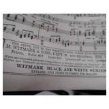 2 VINTAGE BRASS FRENCH HORNS PLUS SHEET MUSIC.