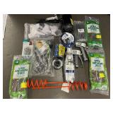 Collection of Garden Tools and Accessories Including Spiral Anchoring Spikes, Nozzles, and Light