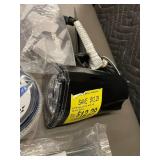 Collection of Garden Tools and Accessories Including Spiral Anchoring Spikes, Nozzles, and Light