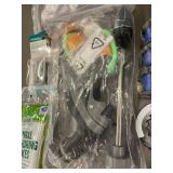 Collection of Garden Tools and Accessories Including Spiral Anchoring Spikes, Nozzles, and Light