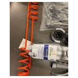 Collection of Garden Tools and Accessories Including Spiral Anchoring Spikes, Nozzles, and Light