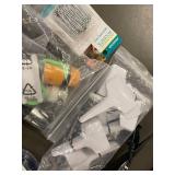 Collection of Garden Tools and Accessories Including Spiral Anchoring Spikes, Nozzles, and Light