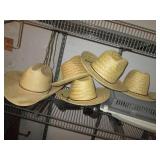Handful of straw cowboy style hats,...