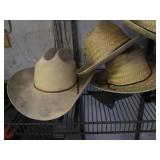 Handful of straw cowboy style hats,...