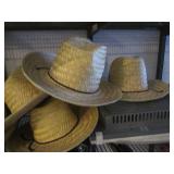 Handful of straw cowboy style hats,...