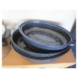 Enamelware roasters with lids in as...