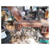 Antique sewing machine in a split w...