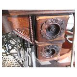 Antique sewing machine in a split w...