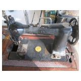 Antique sewing machine in a split w...