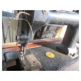 Antique sewing machine in a split w...