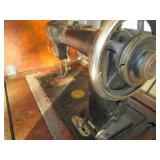 Antique sewing machine in a split w...