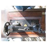 Antique sewing machine in a split w...