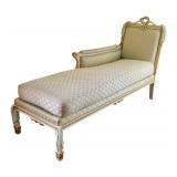 Elegant Upholstered Chaise Lounge with Carved Floral Details