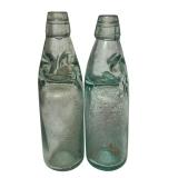 LR - Pair of Vintage 9.5 Inch Codd Glass Bottles