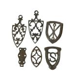 LR - Set of 6 Antique Cast Iron Sad Iron Trivets Assorted Designs