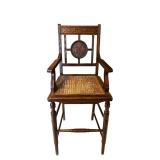 LR - Antique Wooden Chair with Cane Seat and Floral Carved Backrest