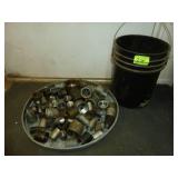 Black Pail of Pipe Fittings