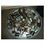 Black Pail of Pipe Fittings