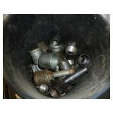 Black Pail of Pipe Fittings
