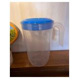 Collection of Decorative Cookie Tins and Plastic Pitcher